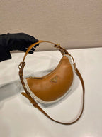 Prada Arqué small shearling shoulder bag