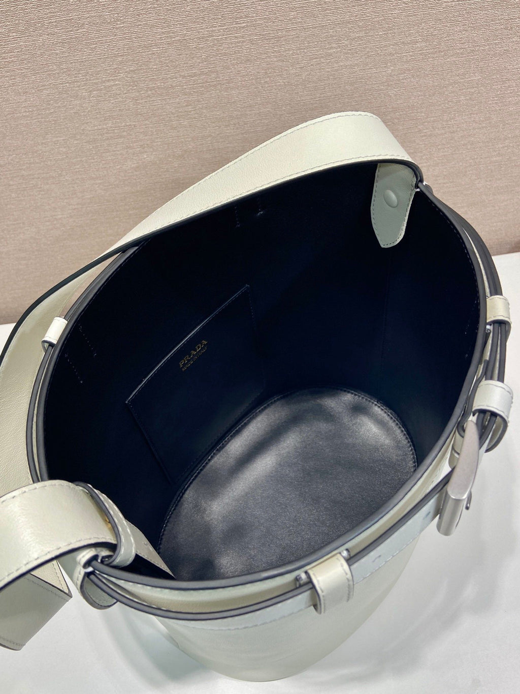 Prada Buckle leather bucket bag with belt