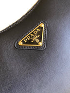 Prada Arqué small leather shoulder bag