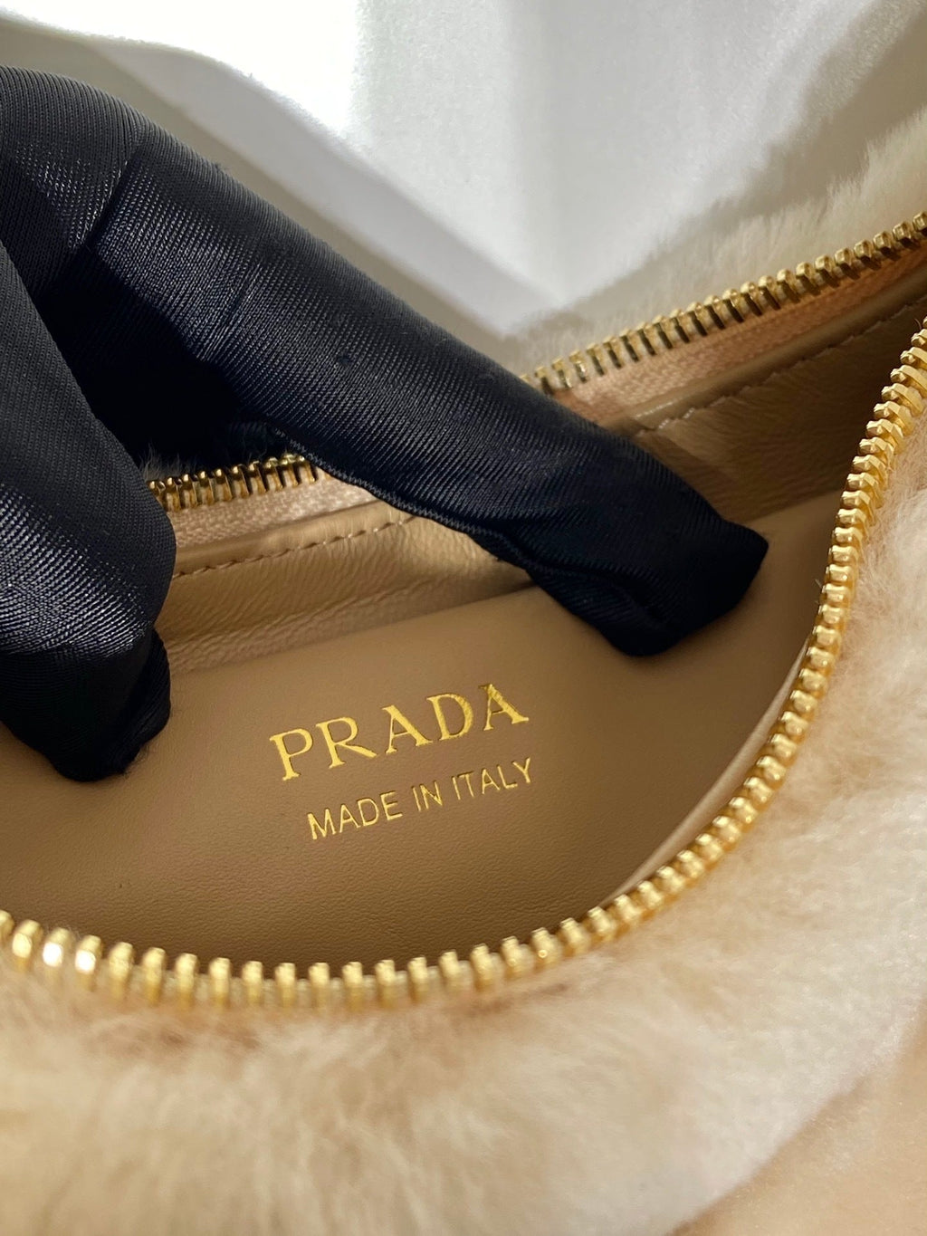 Prada Arqué shearling and leather shoulder bag