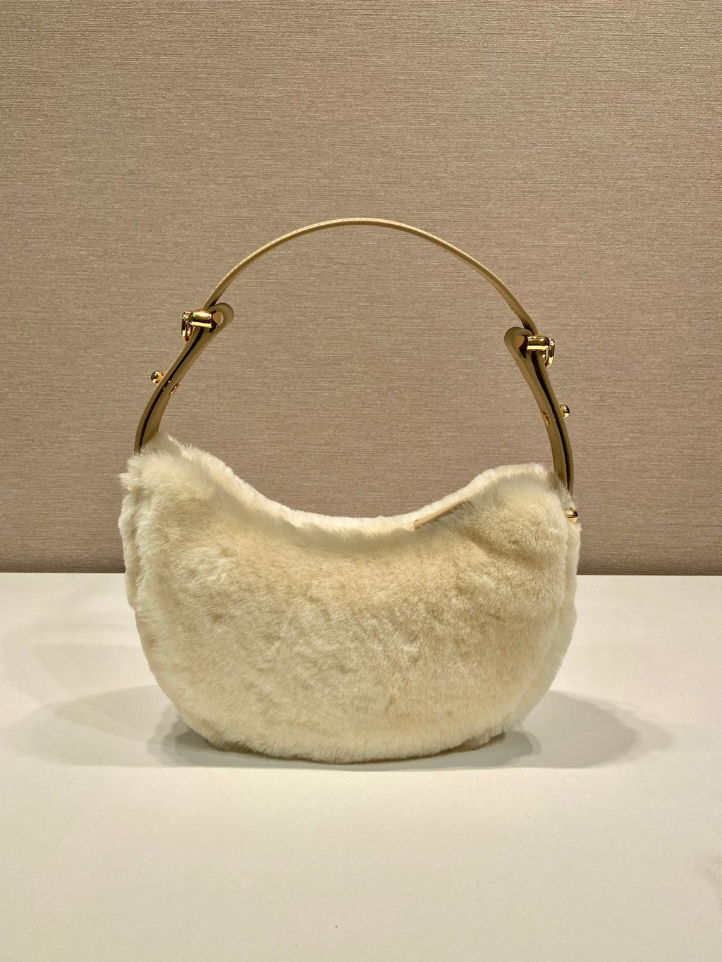 Prada Arqué shearling and leather shoulder bag