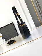 Prada Arqué small leather shoulder bag
